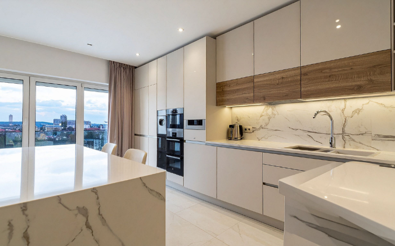 Commercial restaurant kitchen showing hood system, grease ducts, and stainless steel equipment — common areas inspected for ventilation, fire risk, and HVAC performance.